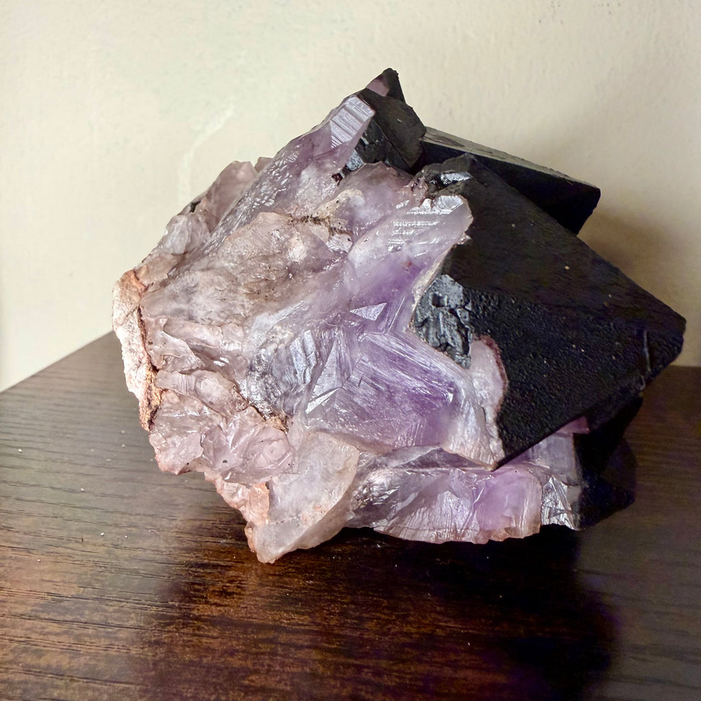 Amethyst cluster with hematite crown