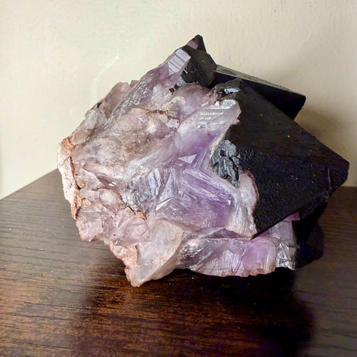 Amethyst cluster with hematite crown