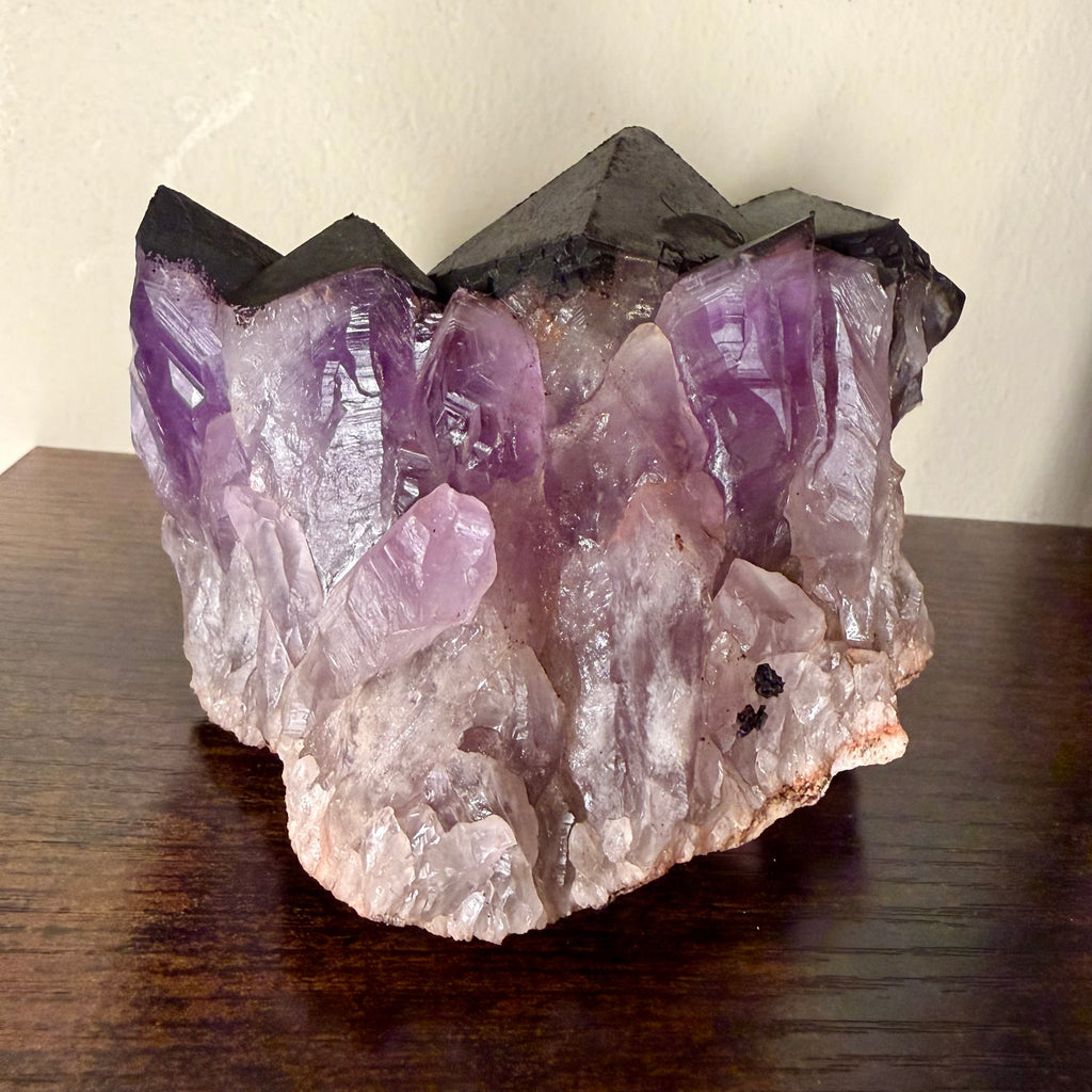 Amethyst cluster with hematite crown