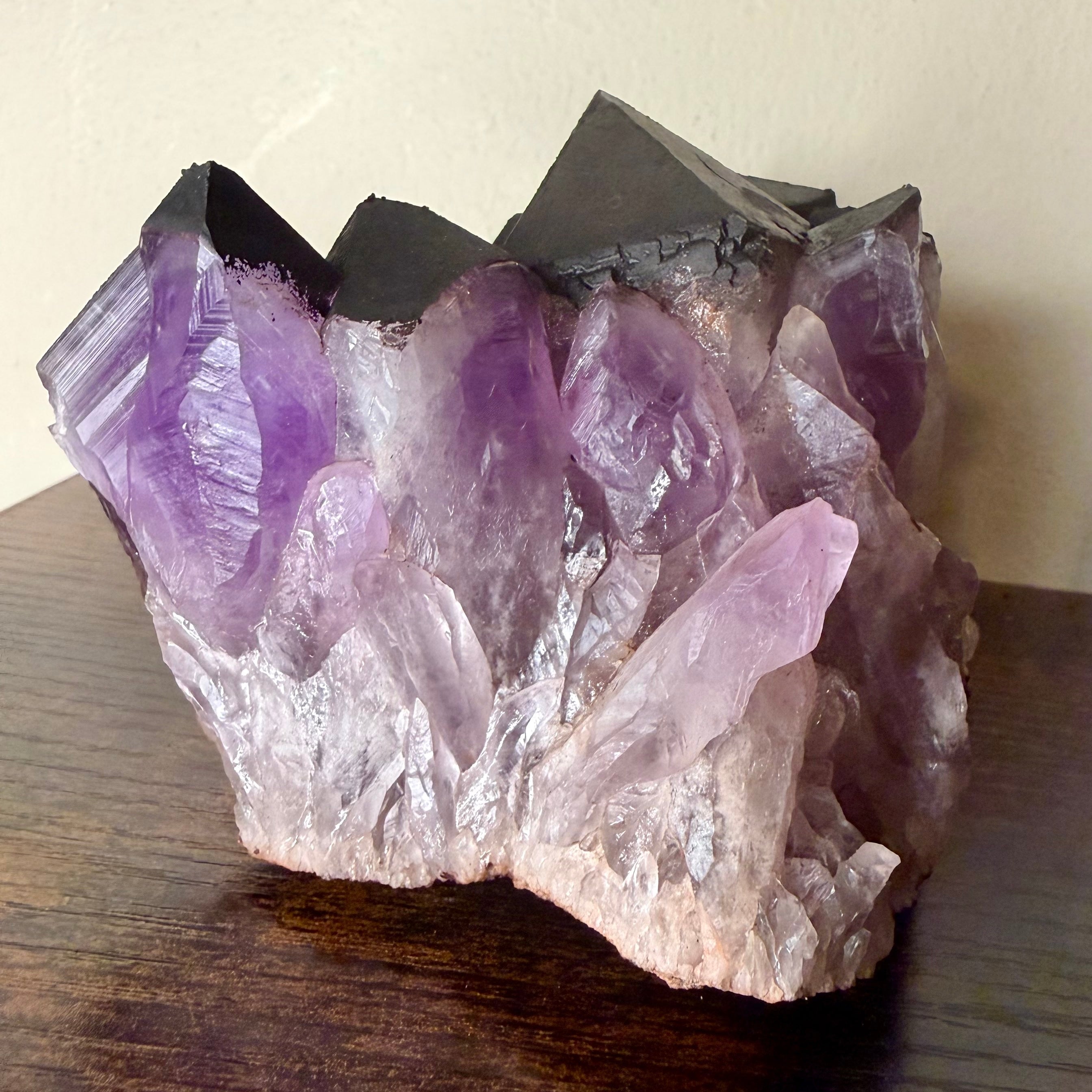 Amethyst cluster with hematite crown
